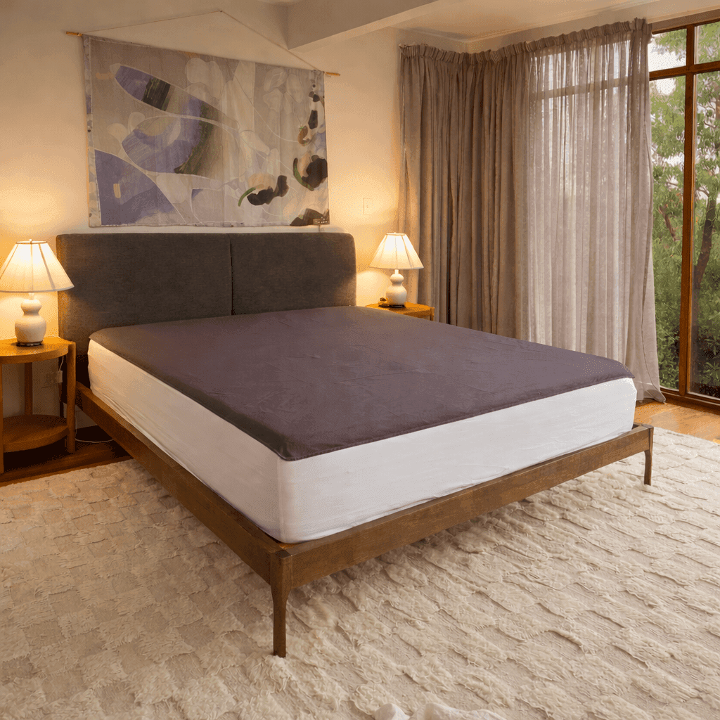 Premium Grounding stainless-steel under-sheet on a bed